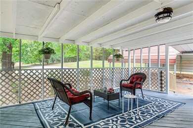 Sunroom / solarium featuring beamed ceiling