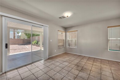 Empty room featuring tile patterned flooring and b