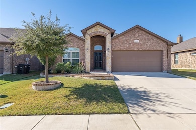 Well kept yard, sidewalks, & plantings welcome you home.