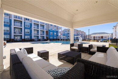 View of patio with outdoor lounge area and a commu