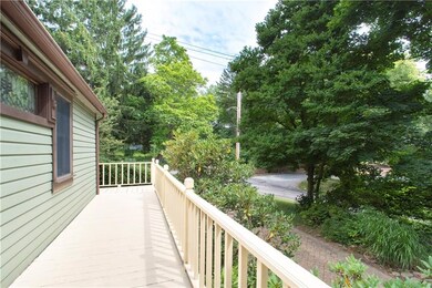 view of front walkway/deck leading to side entranc