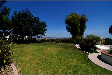 Spacious yard with mature landscaped borders.