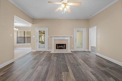Living Room and Fireplace.  Doors to Pario