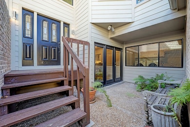 As entering the private gate a charming private courtyard welcomes you in.