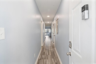 Hallway featuring hardwood / wood-style floors