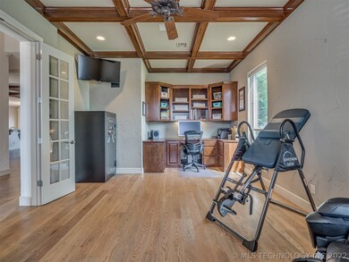 Office with built-ins and stained coffered ceiling