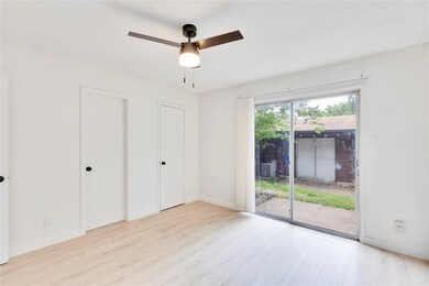 Unfurnished bedroom with access to outside, wood 