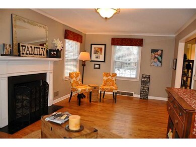 Living Room. Gorgeous living room with gas burning fireplace, hardwood floors & new windows.