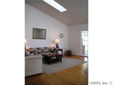 Great Room. Hardwoods, skylights, and showing slid