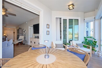 Dining room featuring ceiling fan and dark wood-ty