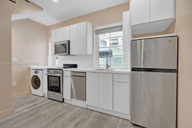 Full Kitchen with a Washer/Dryer combo.