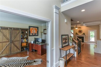 Office with french doors and welcoming foyer