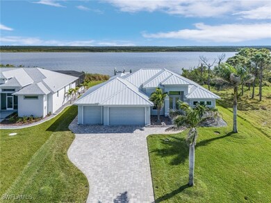 View of front of property with metal roof, a water