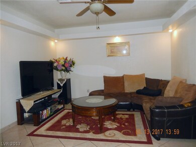 Front formal living room is light ant airy, featur