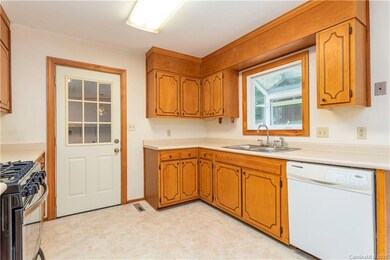 Garage access from the kitchen. Laundry hookups are in the garage.