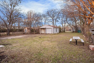 View of yard with a garage and an outdoor structur