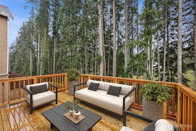 Enjoy main floor private deck and covered patio. Photo's are for representational purposes only. Colors and finishes may differ.