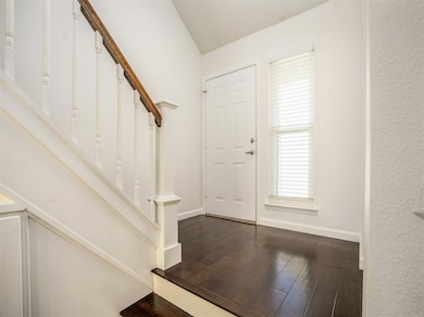 Right as you enter you see the gorgeous wood laminate flooring that is  throughout the home.