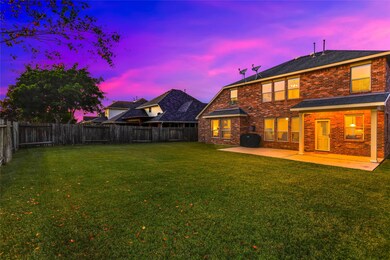 Backyard has plenty of space for a pool with no intrusive power lines! Notice the extended concrete area and covered patio space. All brick exterior means low maintenance!