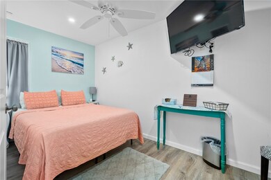 Queen bed in roomy bedroom