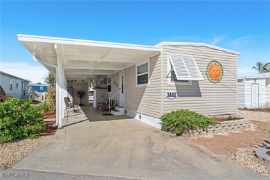 Manufactured / mobile home featuring a carport