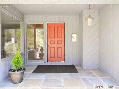 Exterior Front. Warm & welcoming covered front ent