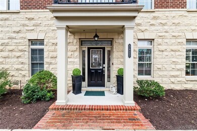 Entrance to property with stone siding