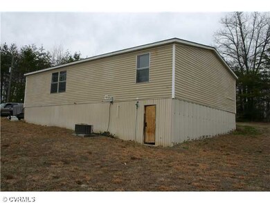 Exterior Back - Great storage space under the hous