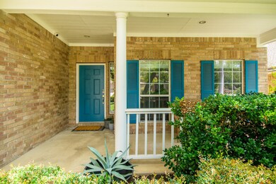 Charming front porch with vibrant blue accents and