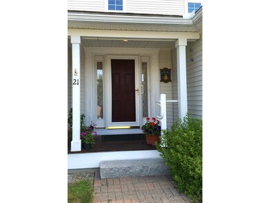 Note the covered entry and granite step to welcome