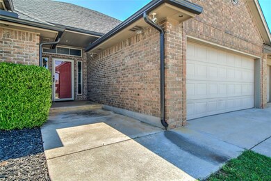 Property entrance with attached 3 car garage