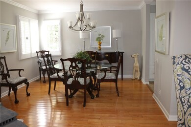 Corner windows with plantation shutters and hardwo