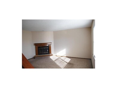 Living Room w/Wood-Burning Fireplace (typical)