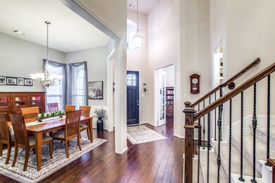 An impressive first impression of the home when you enter through a wood door into a two story entrance with engineered wood flooring.  The door to the right leads to the MUD room and three-car garage.