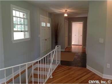 Foyer. Front entry showing stairs to lower walk-ou