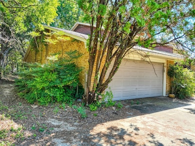 Garage with dirt driveway