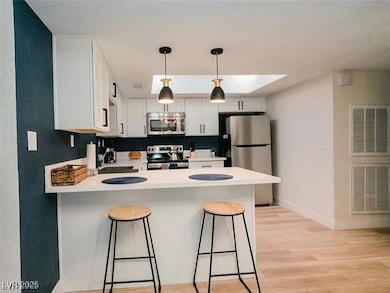 Kitchen with appliances with stainless steel finis