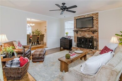 Welcoming family room with hardwood floors and a b