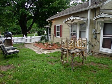 Exterior Back. Fenced in area of the yard is lovel