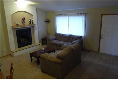 LIVING ROOM WITH WOOD BURNING FIREPLACE