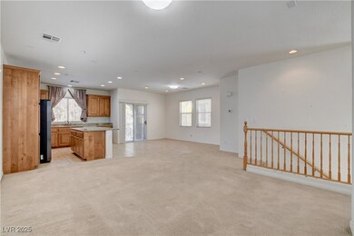Kitchen featuring open floor plan, a kitchen islan