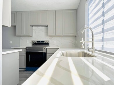 Modern kitchen with sleek cabinetry, countertops,