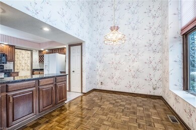 Lovely dinette with hardwood floors and large wind