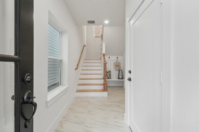 Enter thru the front door to be greeted by bright,