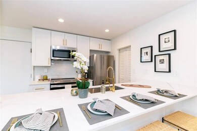 Kitchen featuring stainless steel appliances, whit