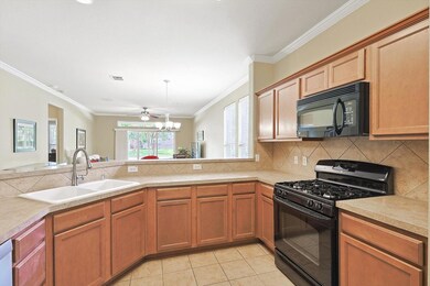 Kitchen featuring light tile patterned flooring, b