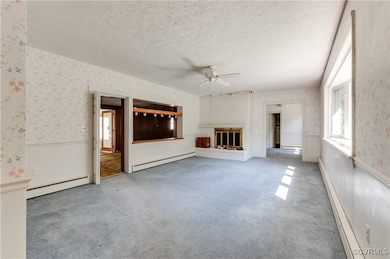 Unfurnished living room with a brick fireplace, a