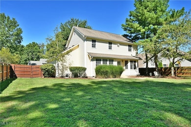 Back of house with a fenced backyard