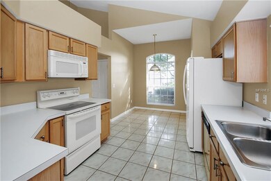 Kitchen view towards front of home featuring a bre