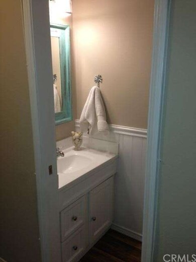 Downstairs bath with new flooring, lighting, mirro